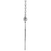 Side view white gold graduation diamond necklace with a long thin pendant on a white background