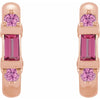 A pair of rose gold hoop earrings featuring a central rectangular pink tourmaline gemstone and two round pink sapphre gemstones on each earring, shown against a plain white background.