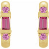 A pair of gold hoop earrings featuring a central rectangular pink tourmaline gemstone and two round pink saphhire gemstones on each earring, shown against a plain white background.