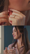 Video of Electroform Cross Gold Charm Pendant and puffed gold hoop earrings on model 