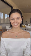 Video of woman talking about her oval emerald gold necklace