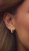 Video of Model wearing our Double Heart Stud Earrings in Solid 14K Yellow Gold