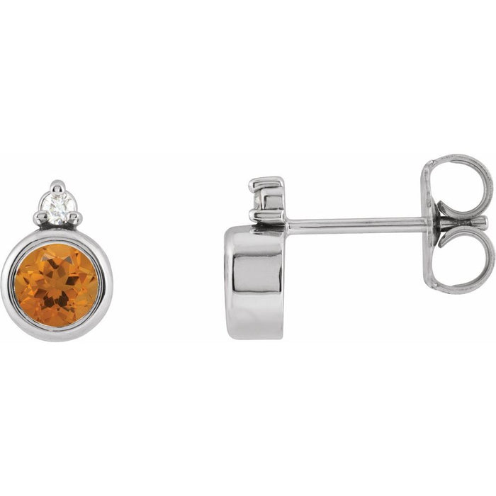 White gold earrings with a round citrine gemstone on a white background