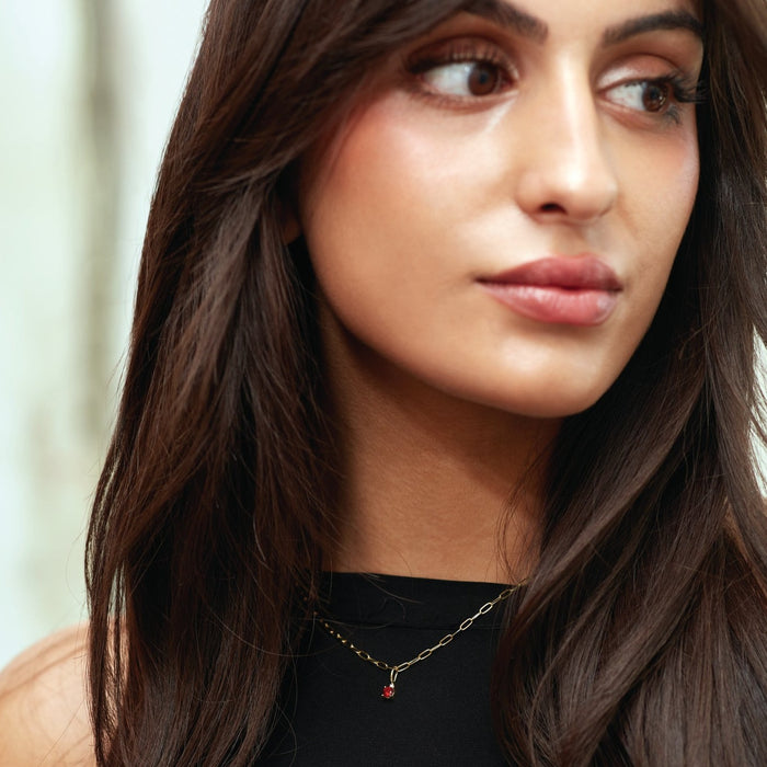 Model wearing our Ruby and Natural Diamond Charm Pendant in Solid 14K Gold