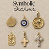 Collection of symbolic charms on a beige background with text 'Symbolic charms'.