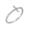 White gold ring with a diamond cross design on a white background