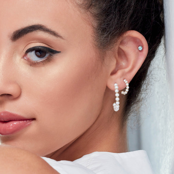 Micro Natural Diamond Bezel-Set Stud Earrings on model 