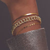 Model wearing 14K Yellow Gold 3/4 Natural Diamond Curb 7" Bracelet by Vintage Magnality