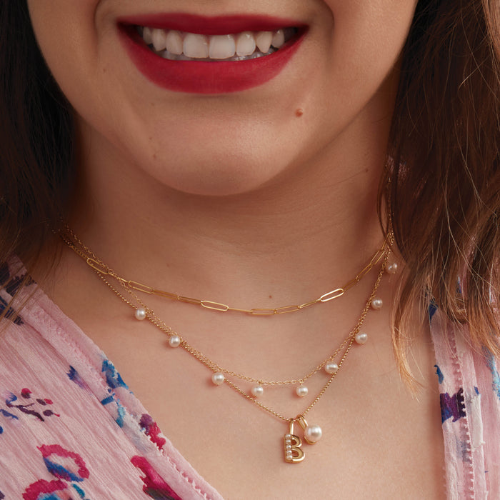 Model wearing our Modern Audrey Freshwater Cultured Pearl 18" Necklace in Solid 14K Yellow Gold