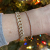 Model wearing 14K Yellow Gold 3/4 CTW Natural Diamond Curb 7" Bracelet by Vintage Magnality
