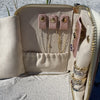 Our blush jewelry travel case showing necklace or bracelet organizer side with flap opened