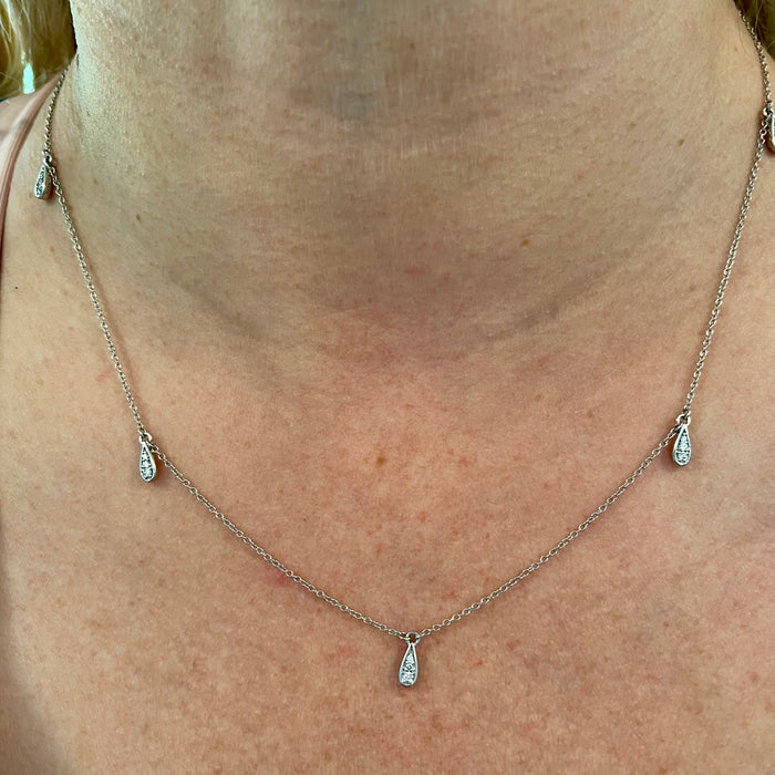 Casual shot showing necklace worn