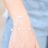 Model Wearing Faith Love Hope Adjustable Bar Bracelet in 14K White Gold or Sterling Silver