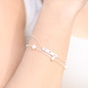 Model Wearing Faith Love Hope Adjustable Bar Bracelet in 14K White Gold or Sterling Silver