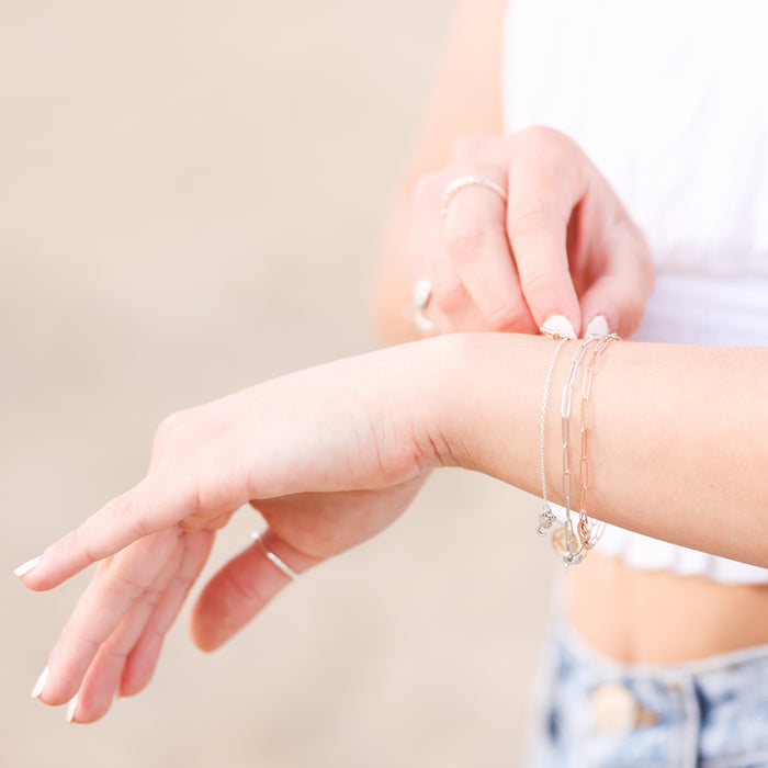 Model wearing both 14K White and Rose Gold Paperclip Bracelets Vintage Magnality