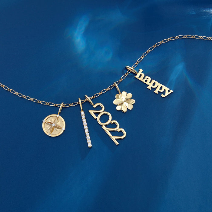 Four Leaf Clover Charm and Other Charms in Solid 14K Yellow Gold on Figaro Gold Chain
