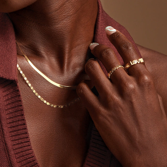 Model wearing our Diamond Solitaire LOVE Block Style Ring in 14K Yellow Gold 