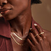 Model wearing our Flexible Herringbone Necklace in Solid 14K Yellow Gold 