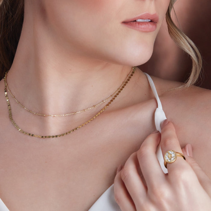 Model Wearing Miraculous Medal White Enamel Solid 14K Yellow Gold Ring with Gold Necklaces